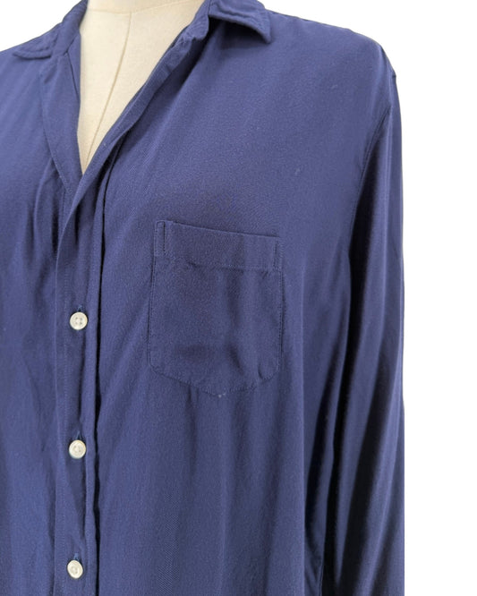 Navy Front button closure, long sleeves with button cuffs, collard v-neck, chest pocket on a mannequin on a white background