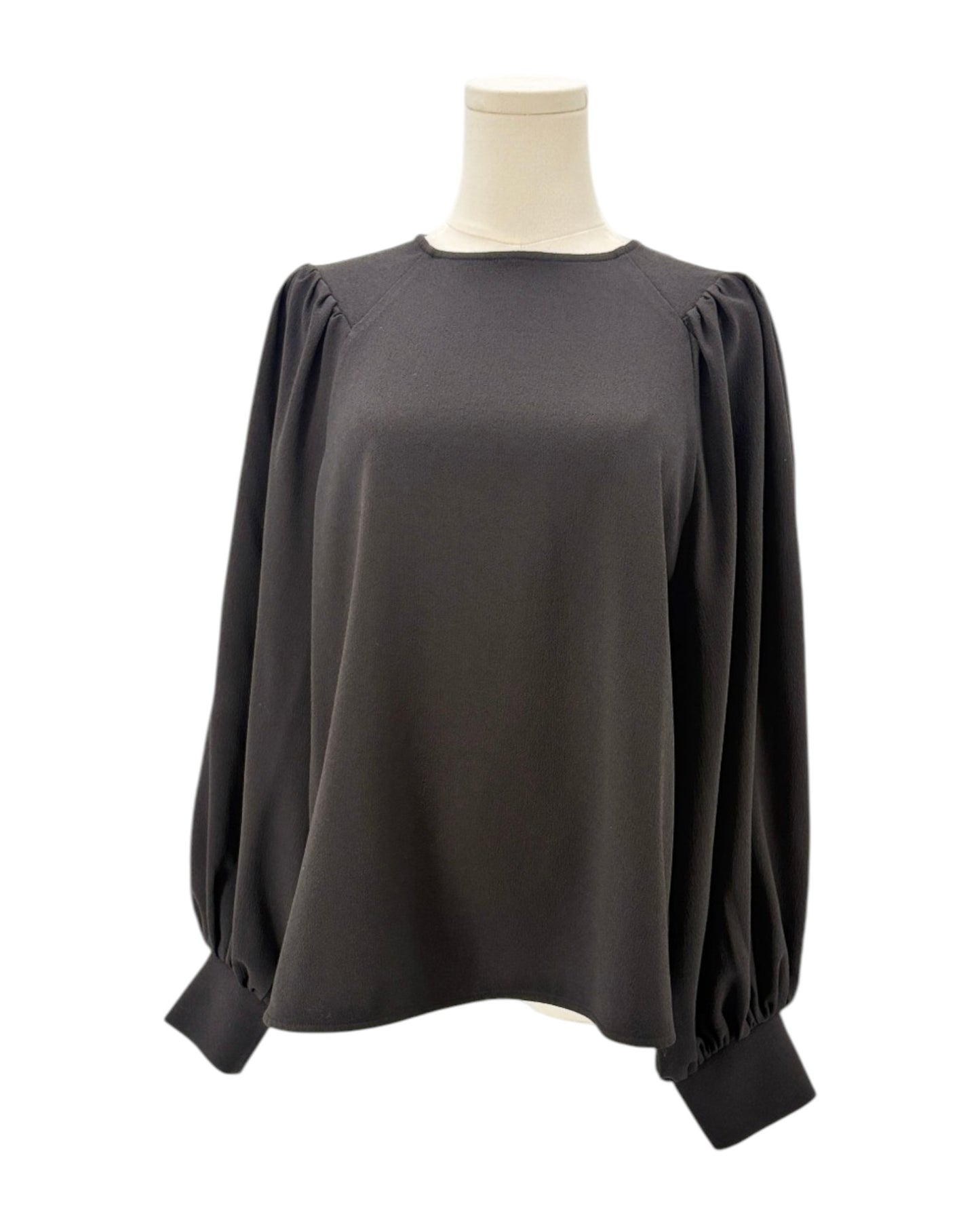 Ganni black blouse on a mannequin with a white background