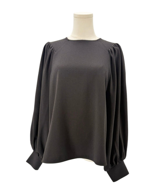 Ganni black blouse on a mannequin with a white background