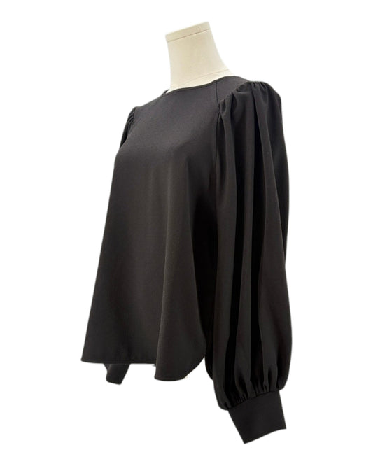 Ganni black blouse on a mannequin with a white background
