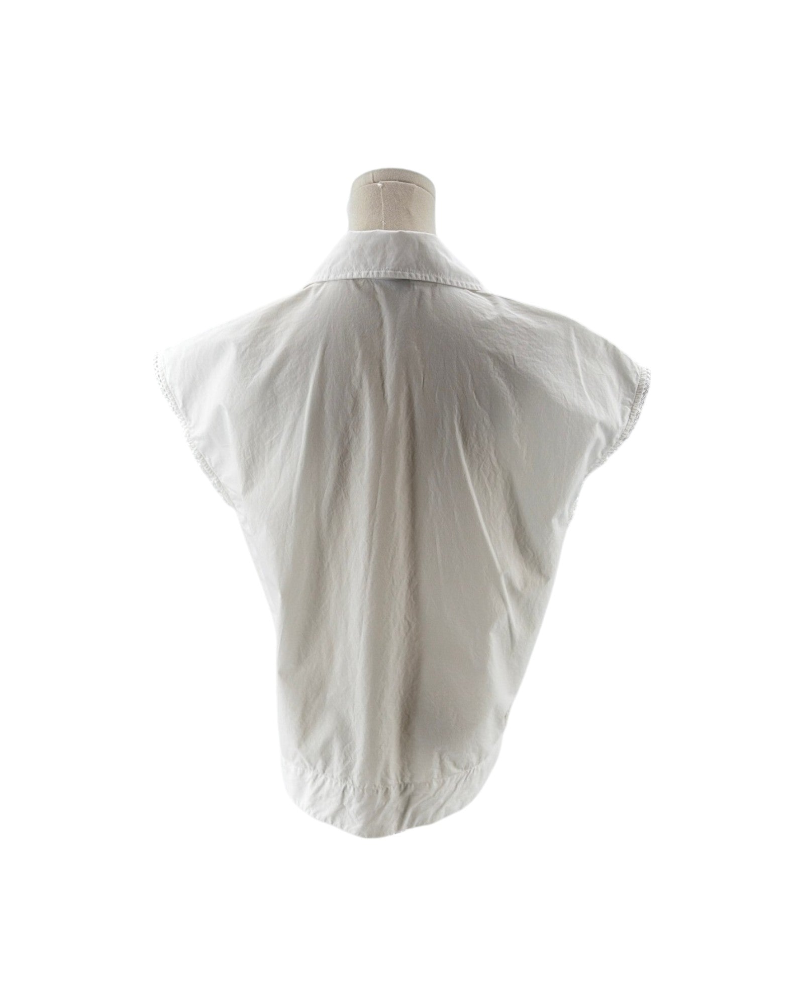 White shirt on a mannequin against a white background