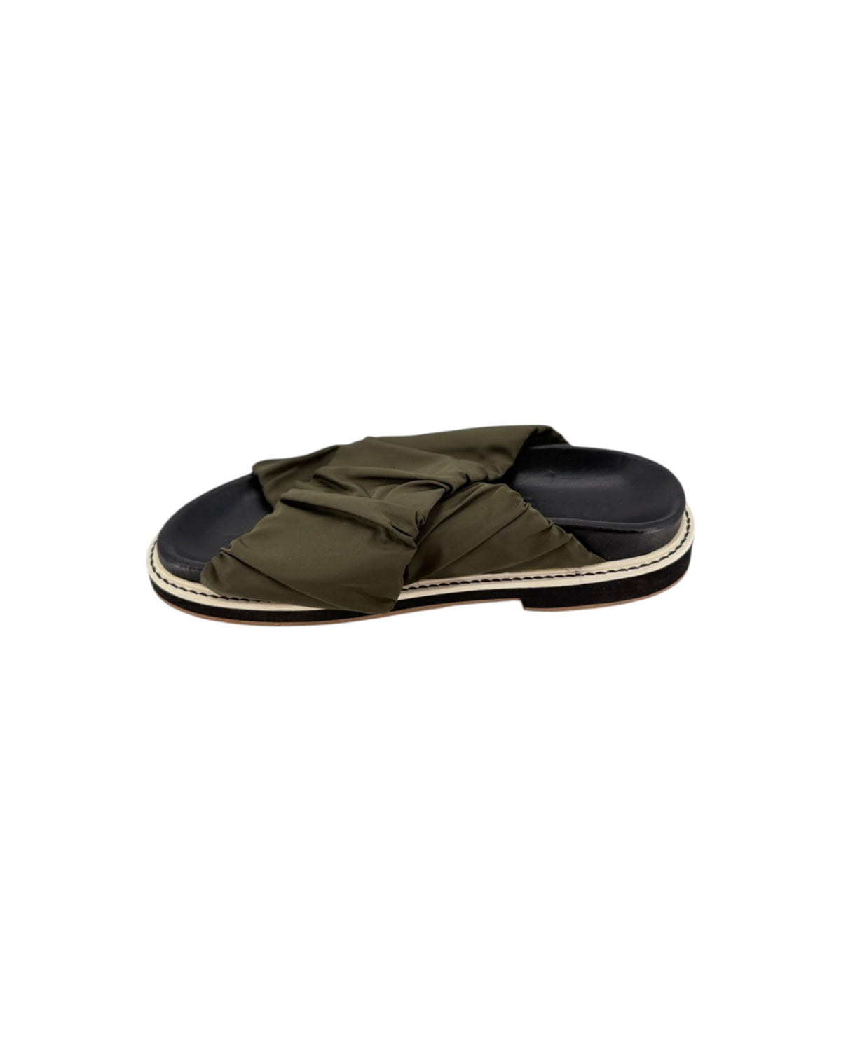 Black slip on sandals with two thick green straps across the top on a white background