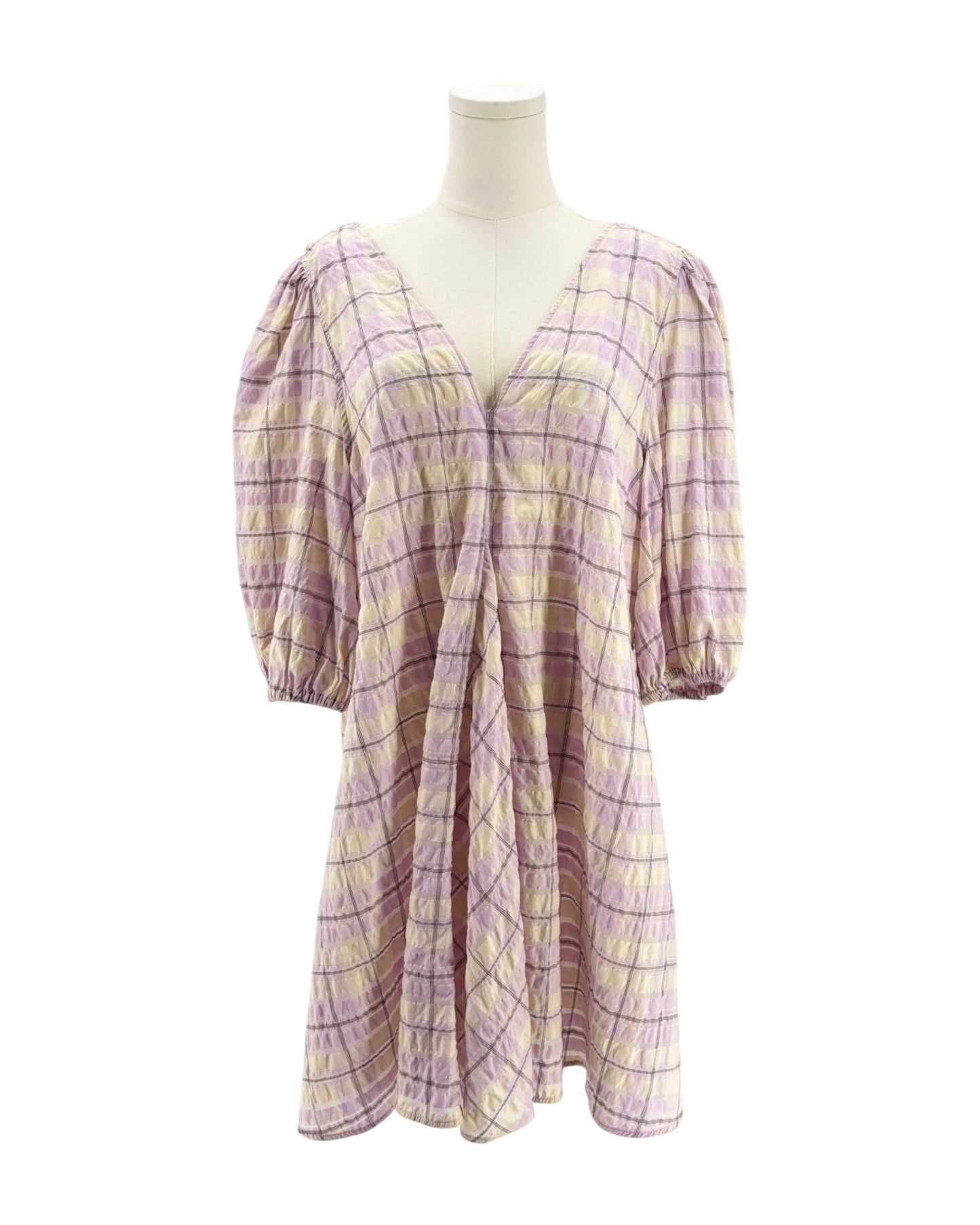 Plaid dress on a mannequin against a white background