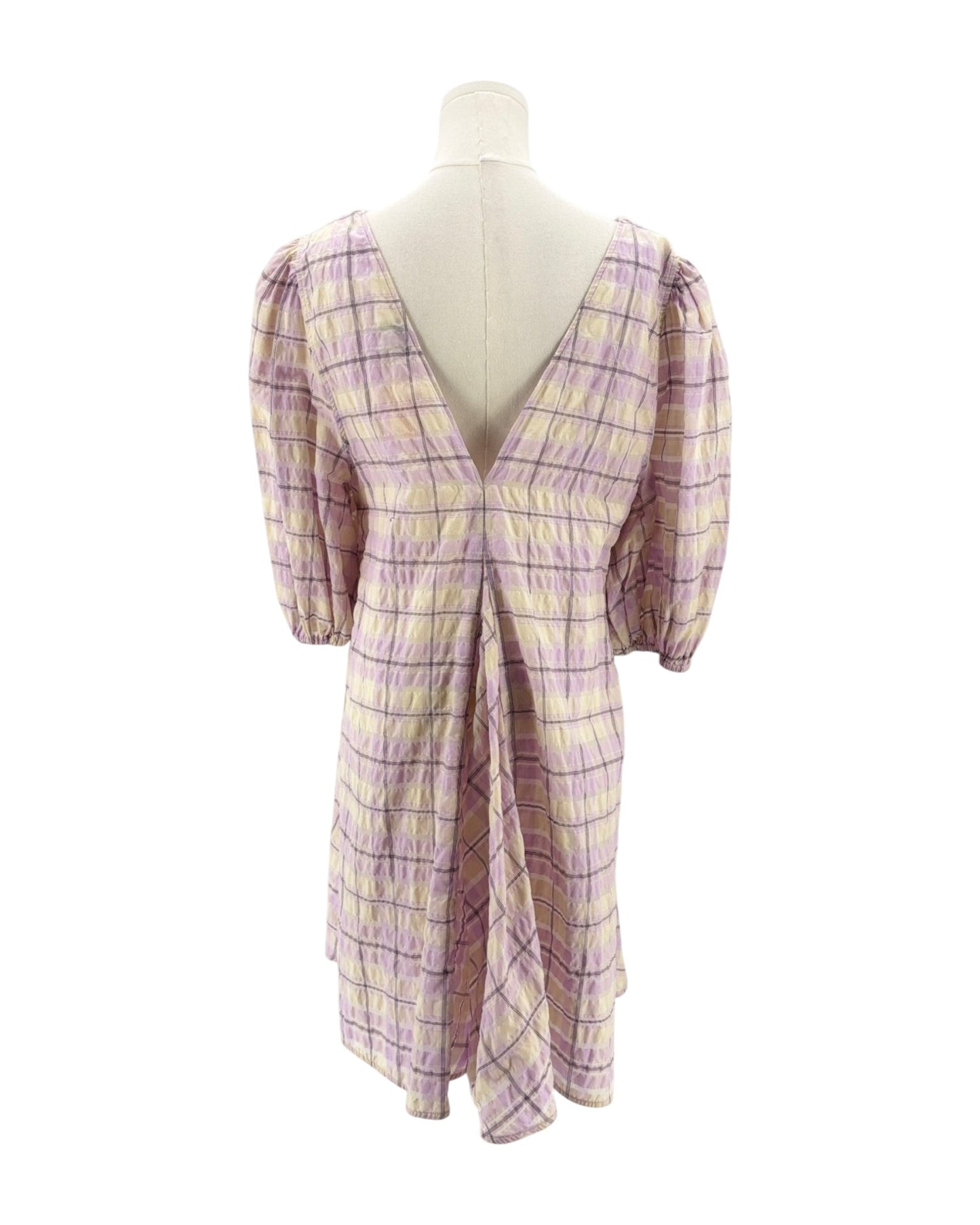 Plaid dress on a mannequin against a white background