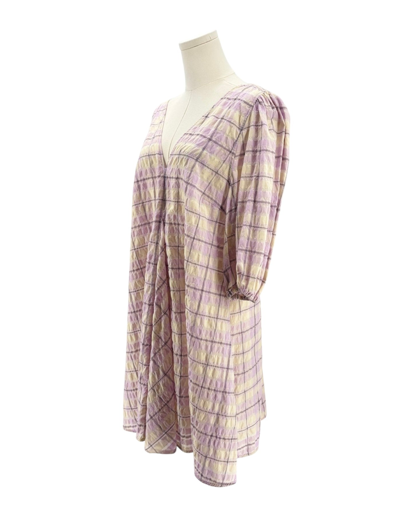 Plaid dress on a mannequin against a white background