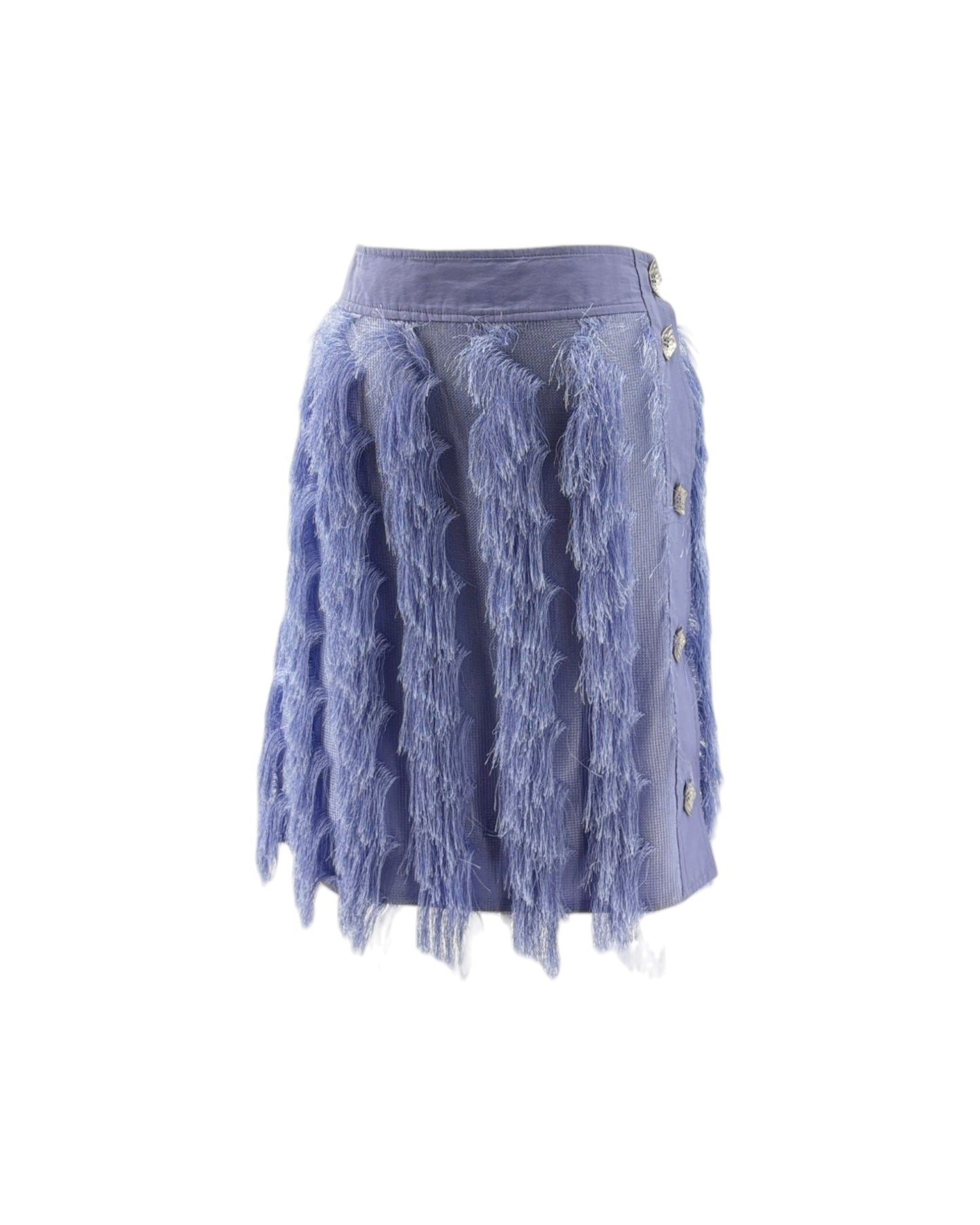 A light blue denim mini skirt featuring a wide waistband, vertical ruffled tulle panels, decorative silver buttons on the side.