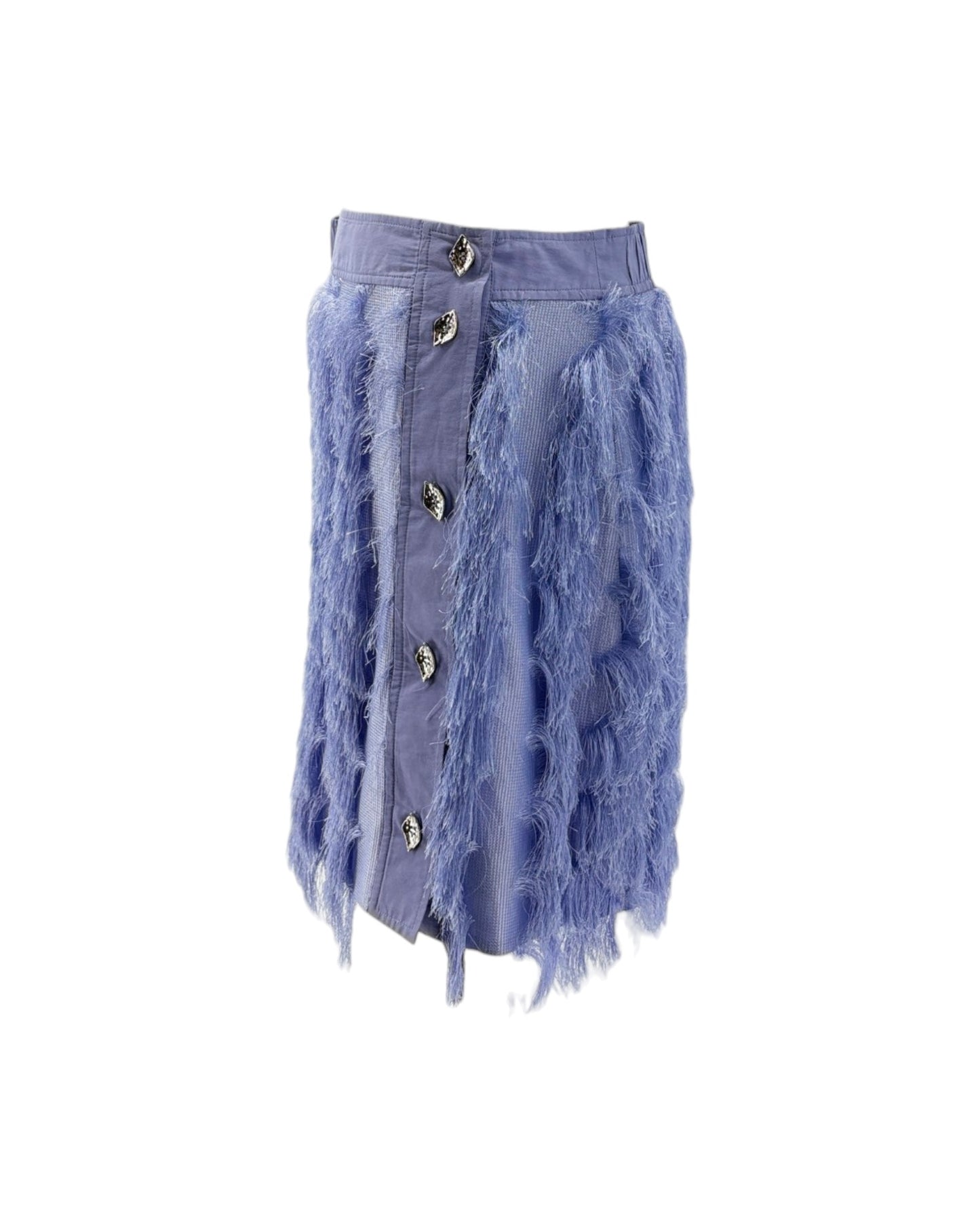 A light blue denim skirt featuring a raw, frayed tassel trim along the front button placket and sides, with decorative metallic buttons, shown against a plain white background.