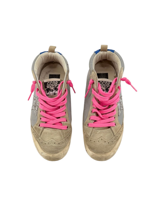 Pair of gray sneakers with pink laces on a white background