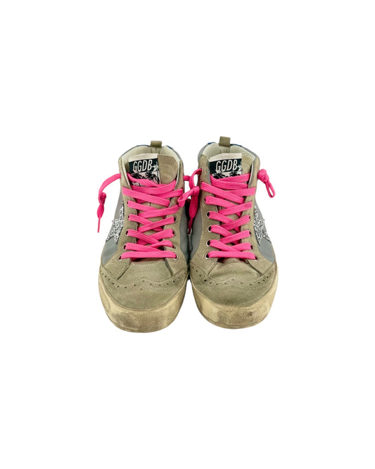Grey suede mid rose sneakers with silver glitter star logo, neon pink laces, weathered midsole, blue and white golden goose heel logo on a white background