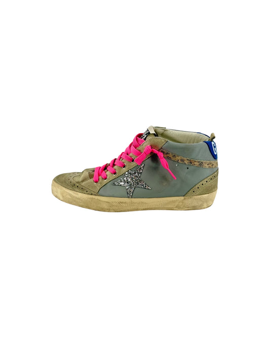 Grey suede mid rose sneakers with silver glitter star logo, neon pink laces, weathered midsole, blue and white golden goose heel logo on a white background