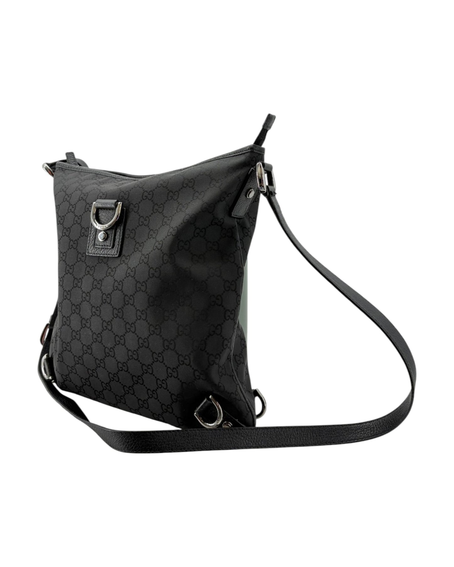 Black patterned shoulder bag on a white background
