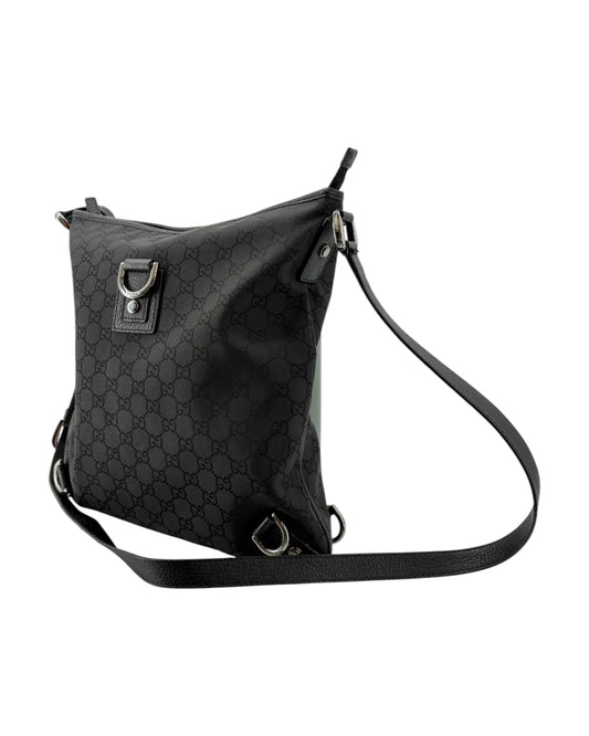 Black patterned shoulder bag on a white background