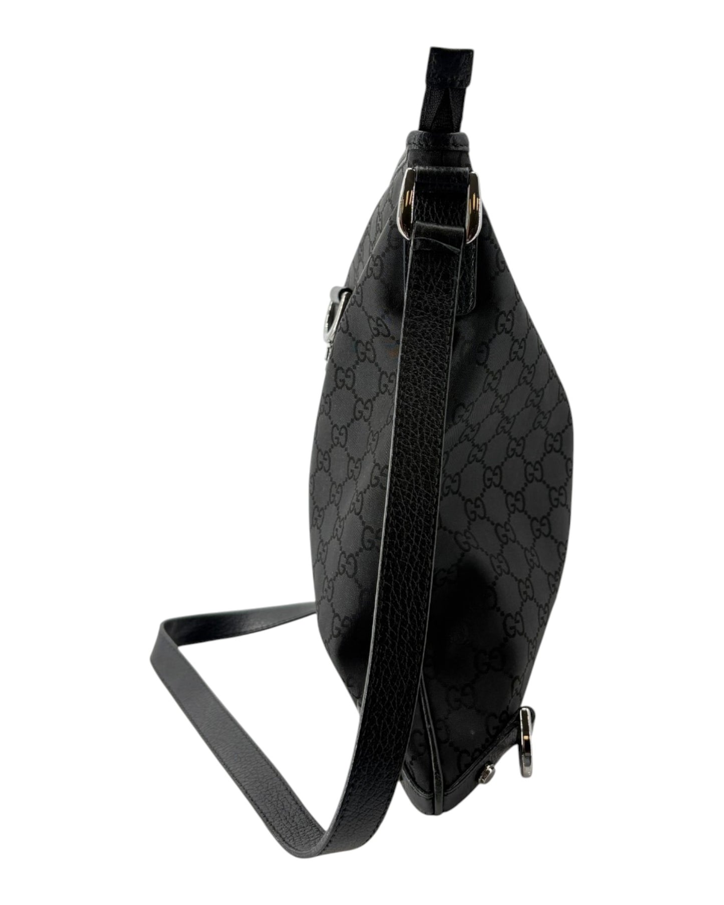 Black patterned crossbody bag on a white background