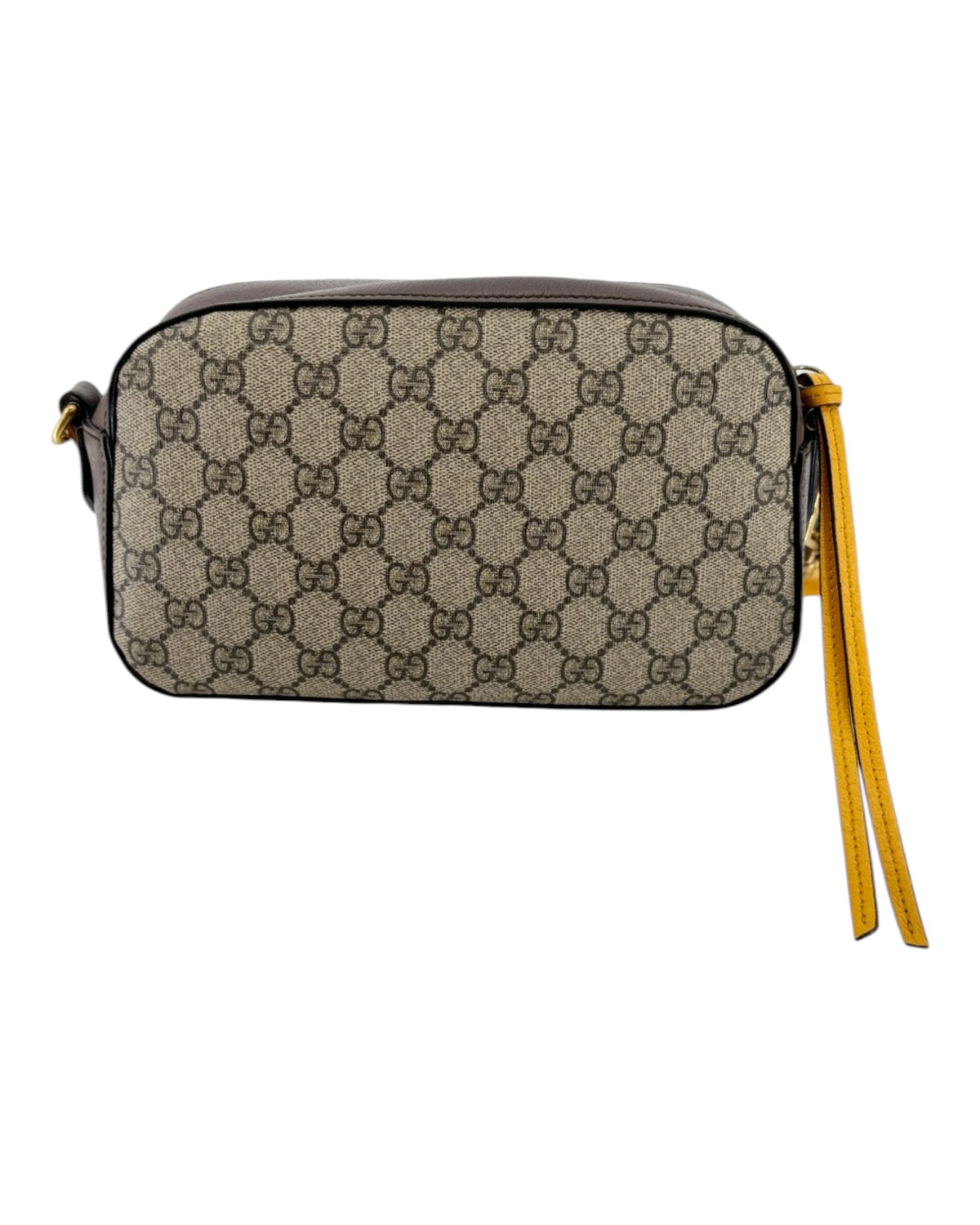 Small leather double G gucci handbag with a yellow zipper tassel on a white background