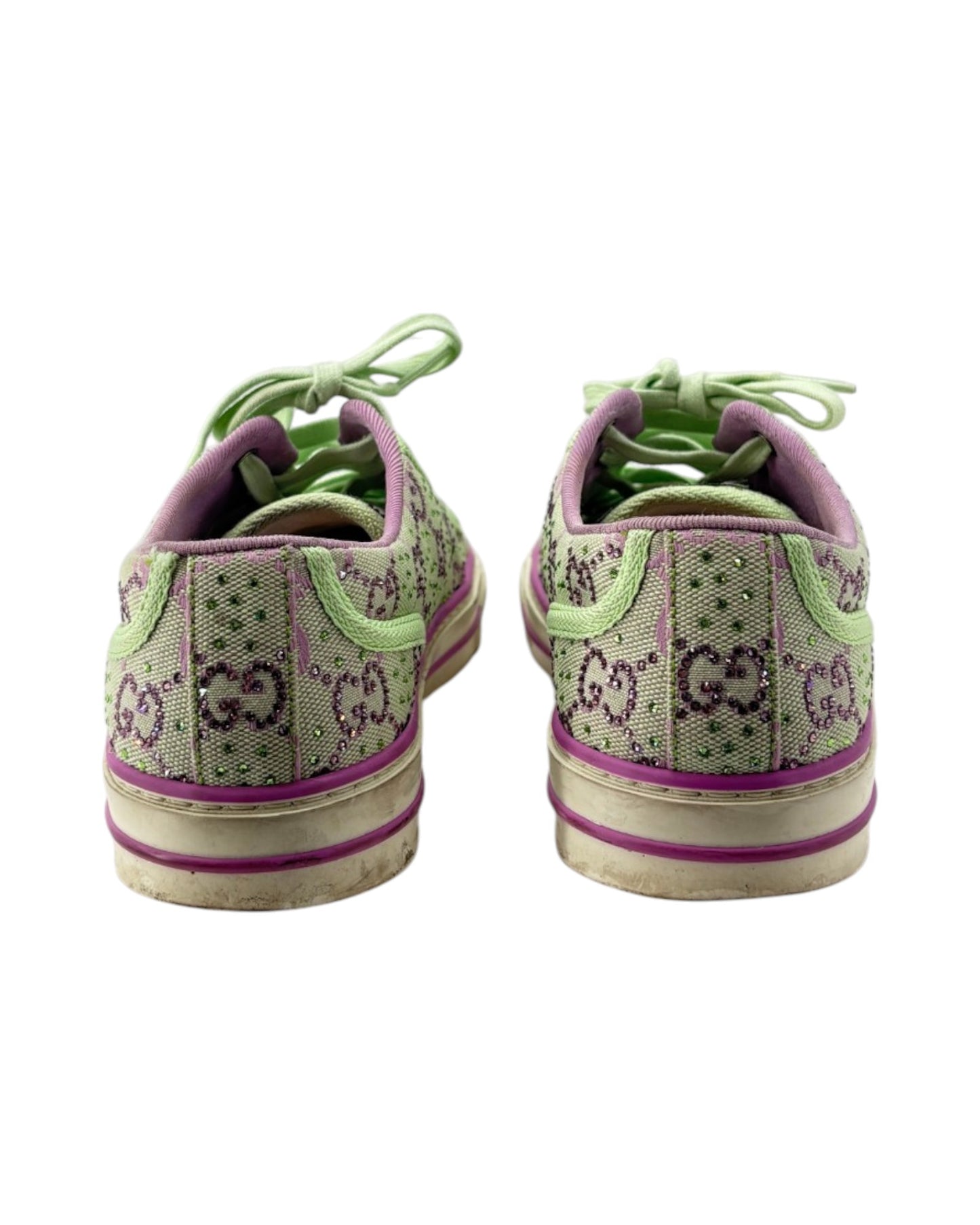 Pair of green and purple sneakers with 'GG' pattern on a white background