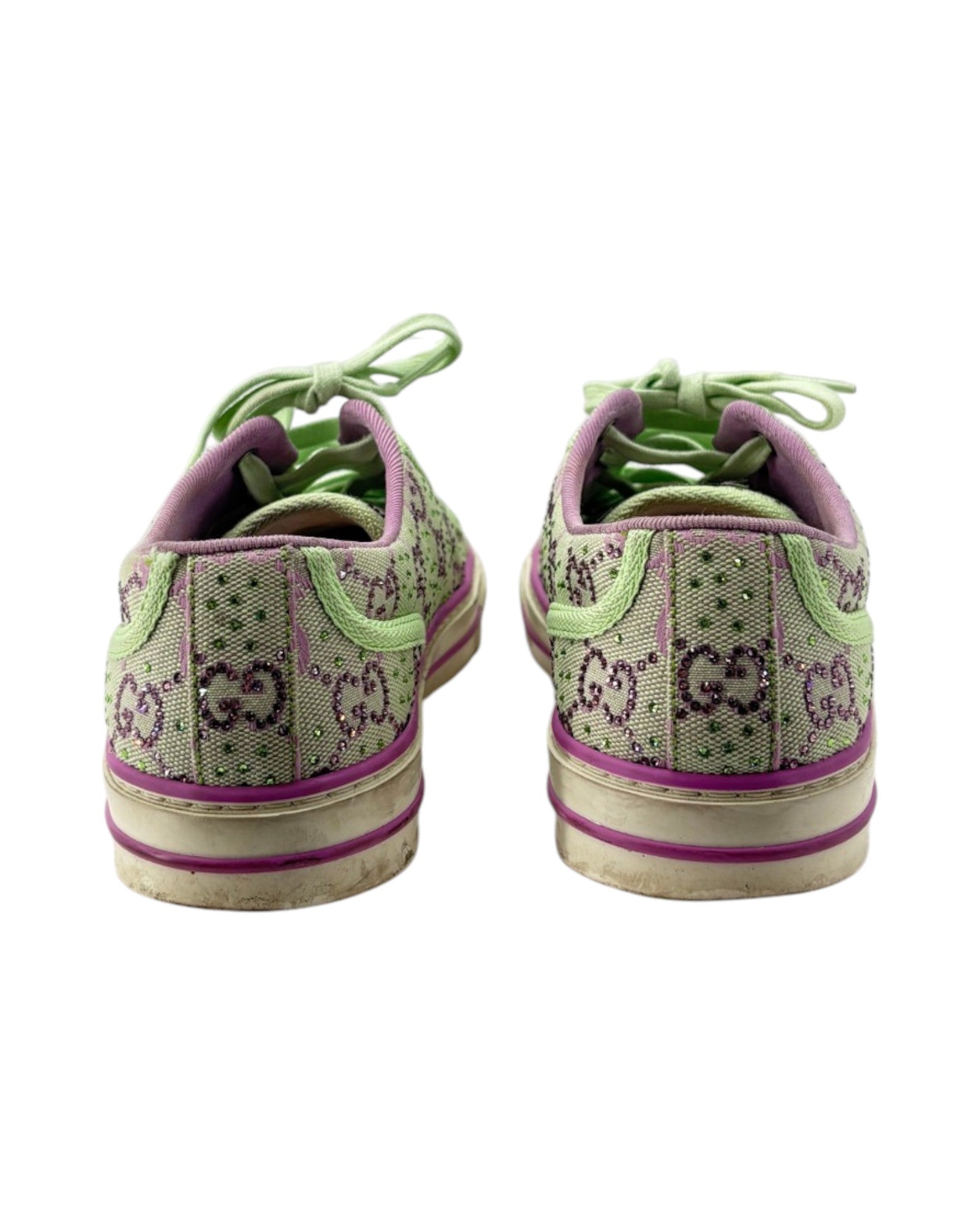 Pair of green and purple sneakers with 'GG' pattern on a white background