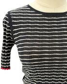 Guest in Residence black and white striped sweater on a mannequin with a white background
