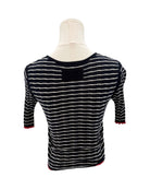 Guest in Residence black and white striped sweater on a mannequin with a white background