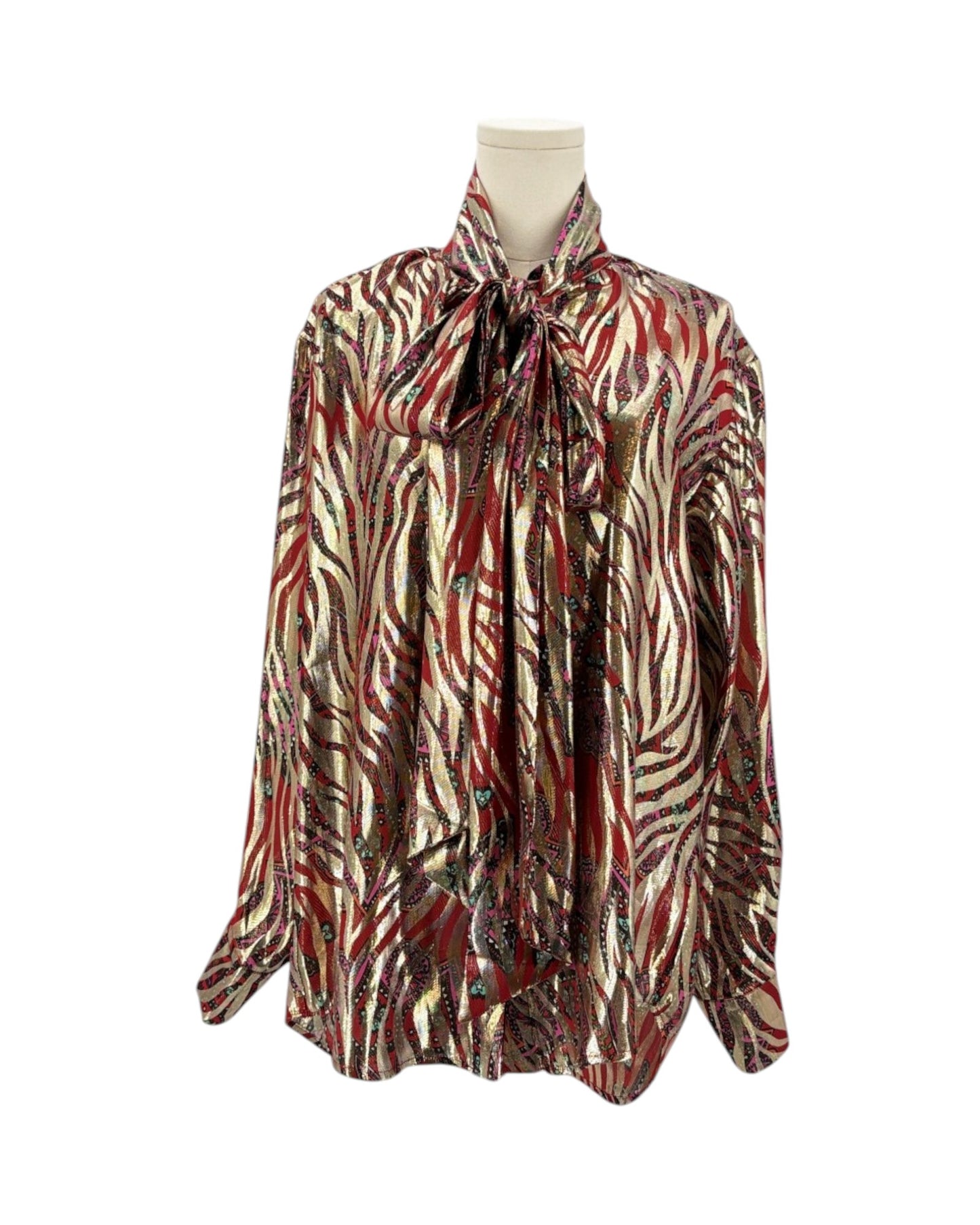 A long-sleeve blouse with a tie-neck collar, featuring an abstract zebra-like pattern in red, brown, black, and beige, displayed on a mannequin torso against a white background.