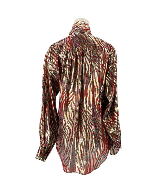 A long-sleeve button-up shirt with a metallic zebra-stripe pattern in red, gold, and brown, displayed on a mannequin torso against a white background.