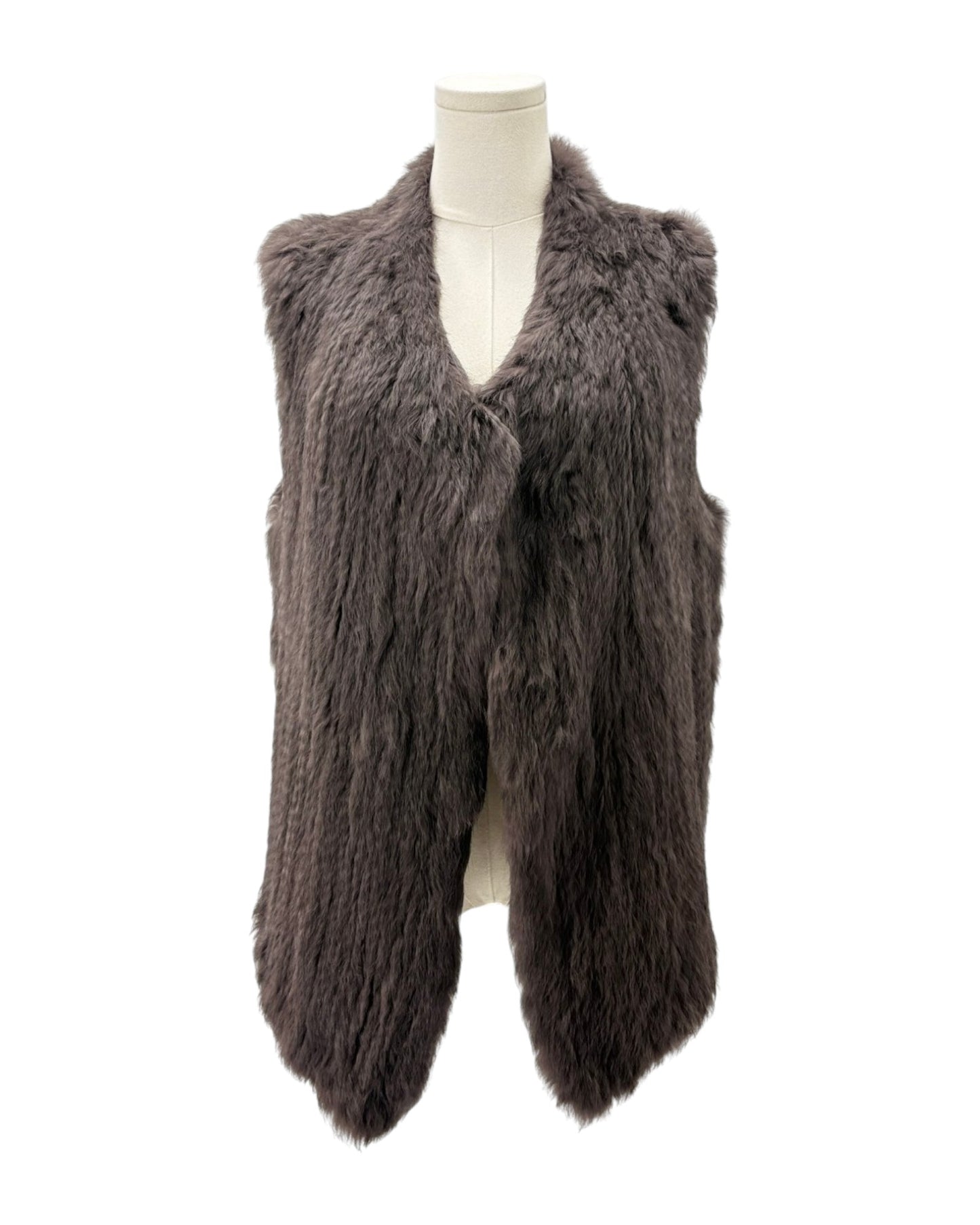 Brown faux fur vest on a mannequin against a white background