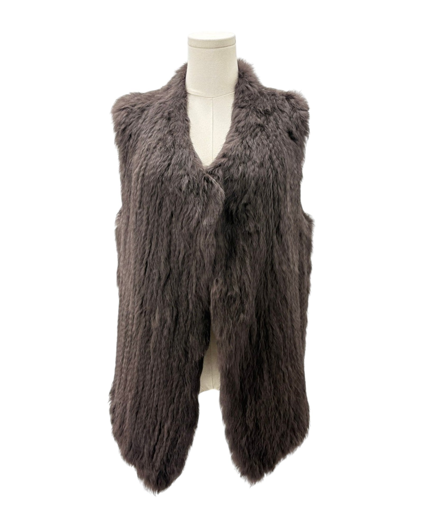 Brown faux fur vest on a mannequin against a white background