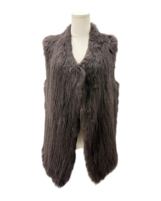 Brown faux fur vest on a mannequin against a white background
