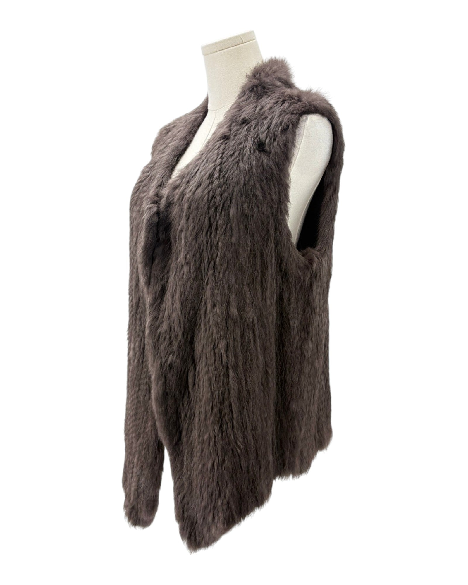 Brown fur vest on a mannequin against a white background