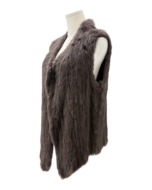 Brown fur vest on a mannequin against a white background