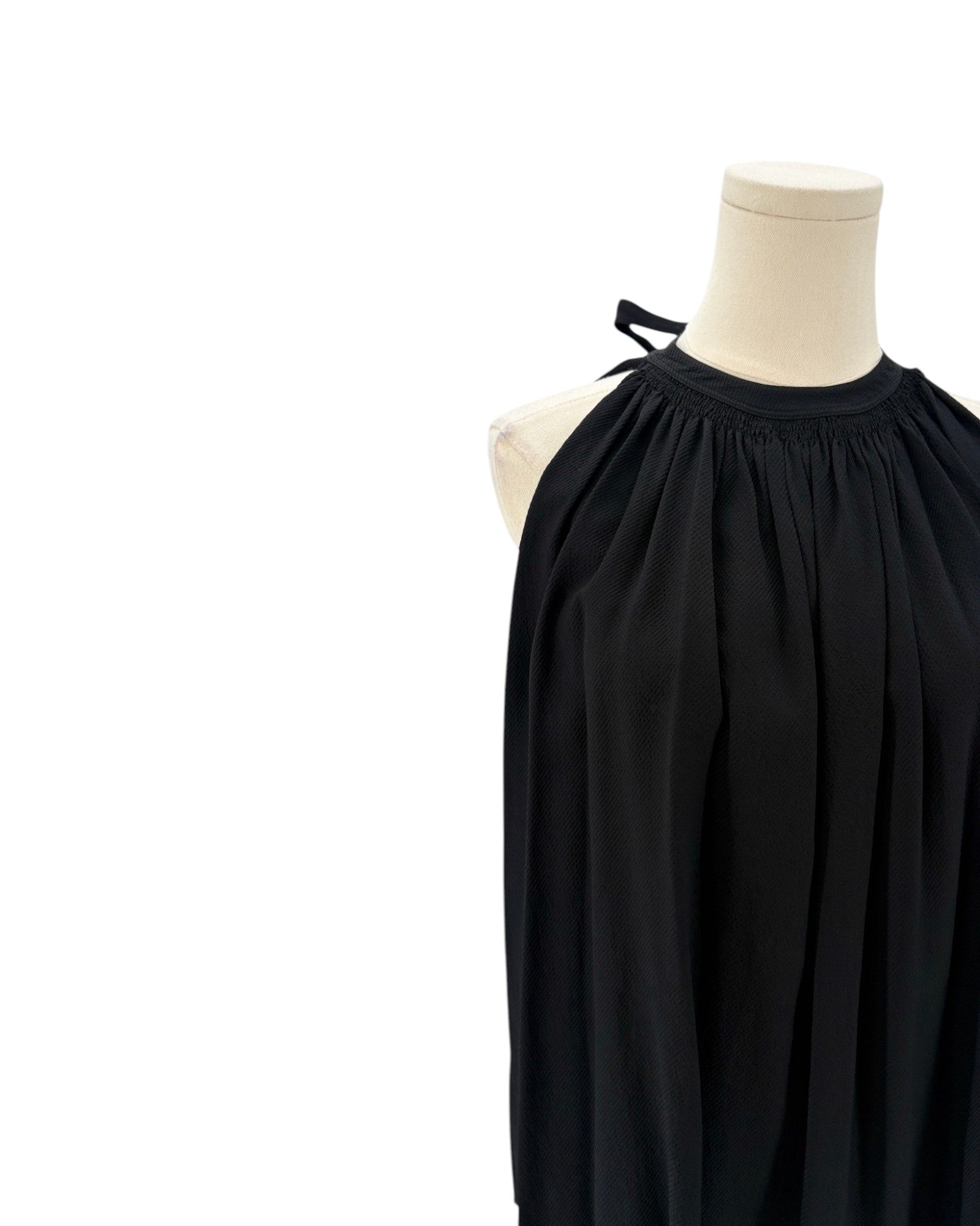 Helmut Lang black sleeveless top on a mannequin against a white background
