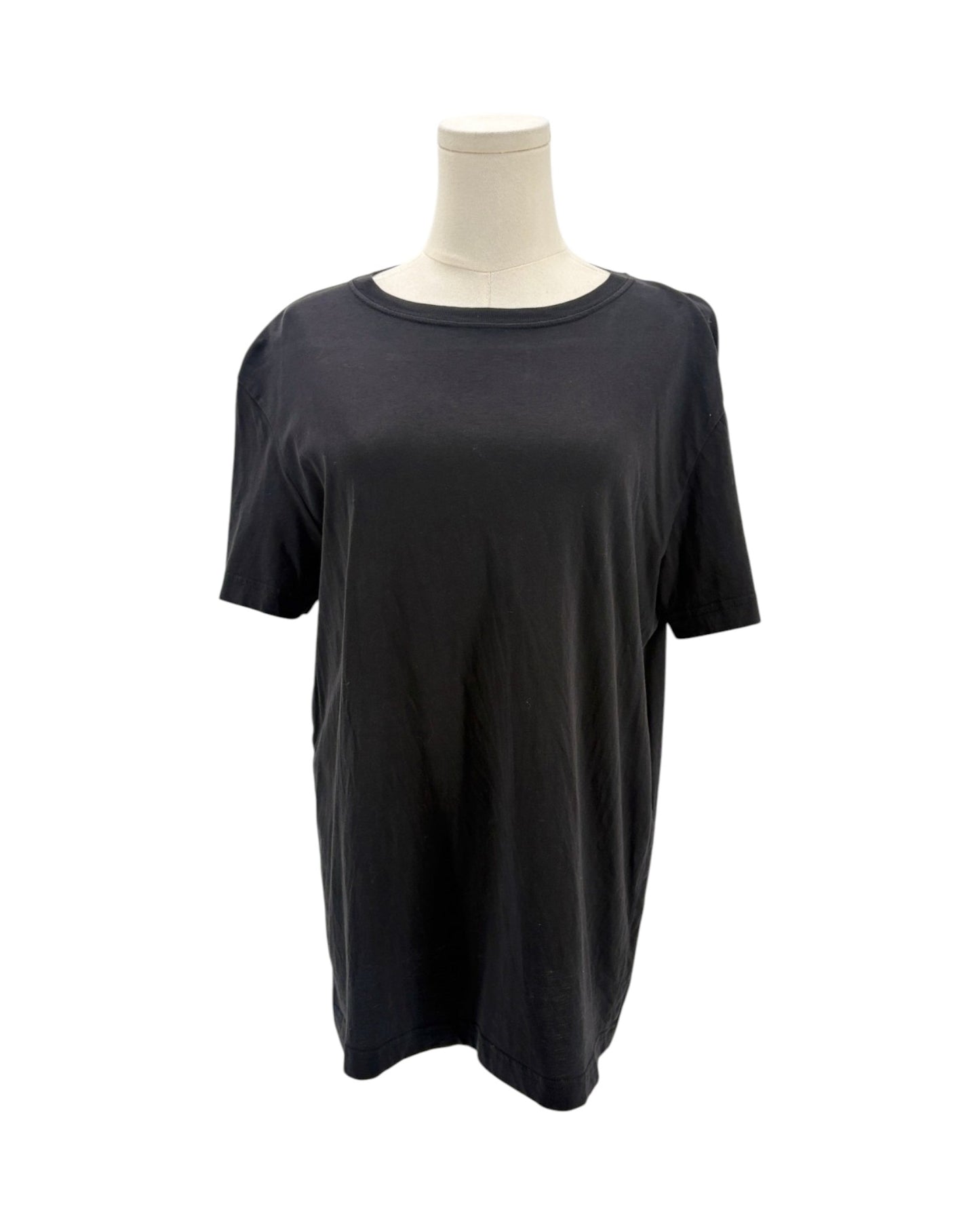 Black t-shirt on a mannequin against a white background