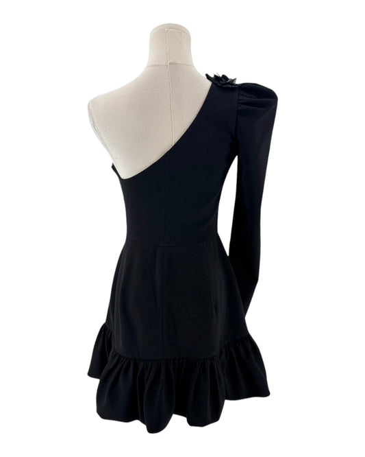 One should long sleeve black mini dress with a ruffle at the bottom hem. 