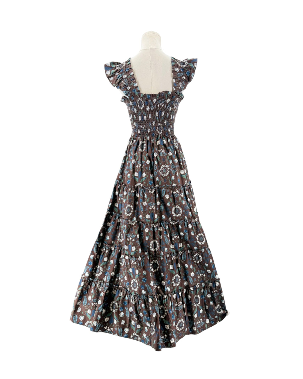 Brown and blue floral sleeveless maxi dress on a mannequin on a white background
