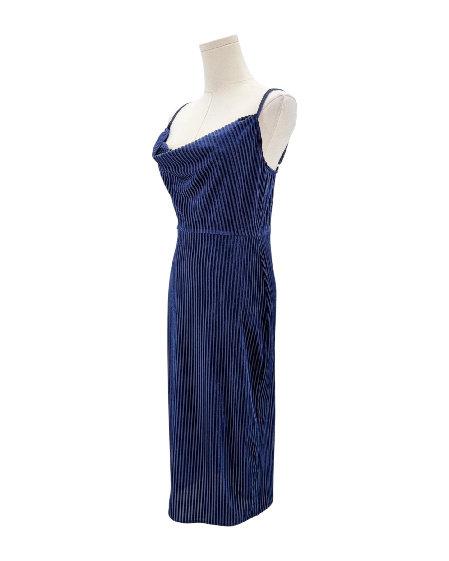 Blue pleated dress on a mannequin against a white background