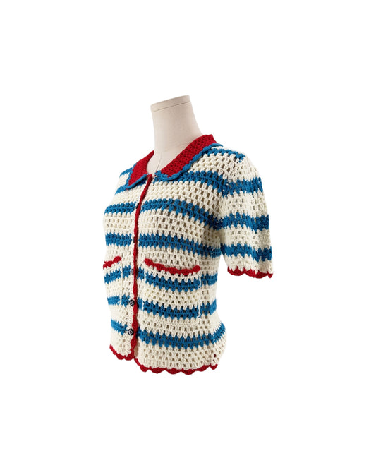 Blue white and red short sleeve, front patch pockets, button front, vertical striped print, peter pan style collar cardigan sweater on a white background on a mannequin