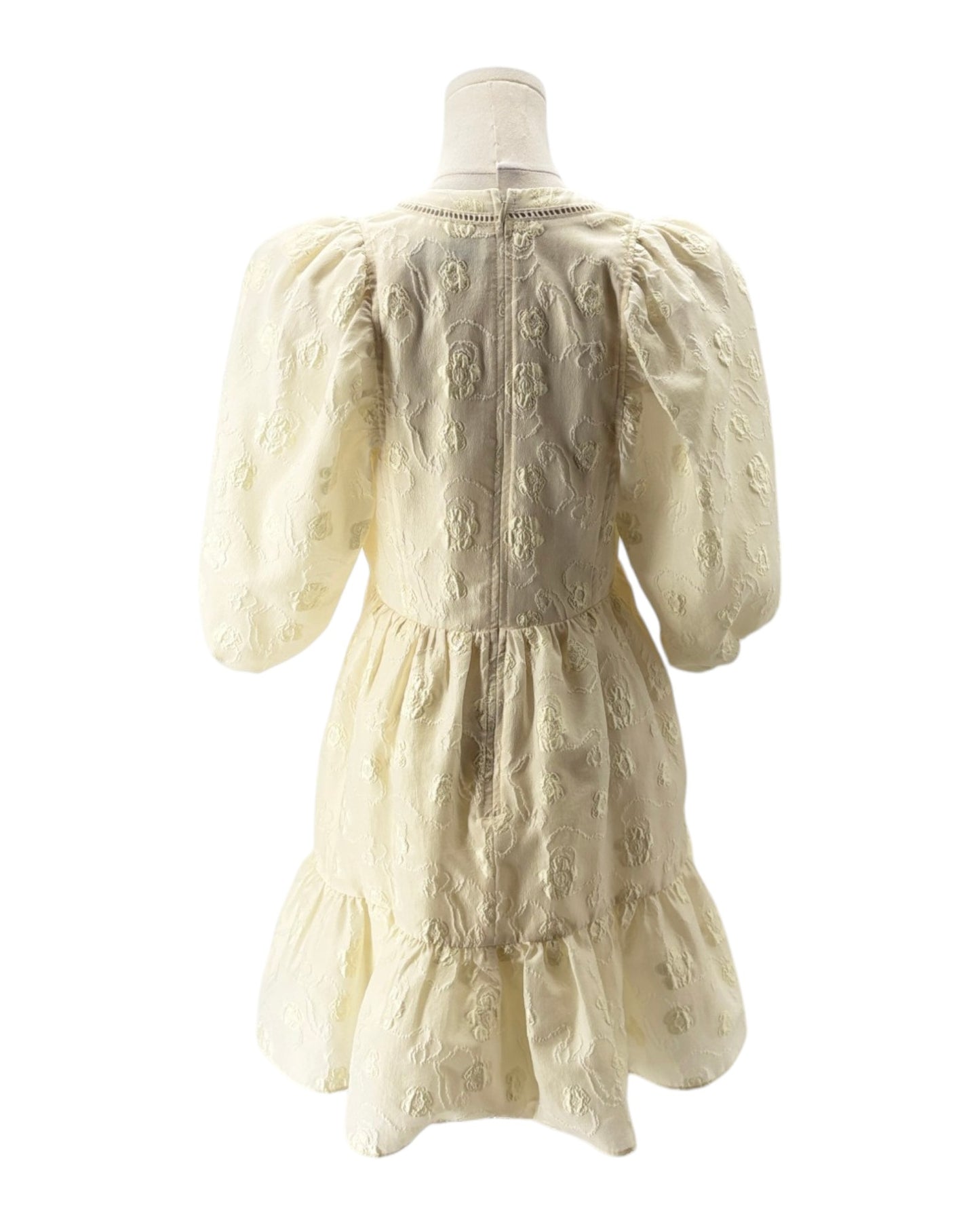 White dress on a mannequin against a white background