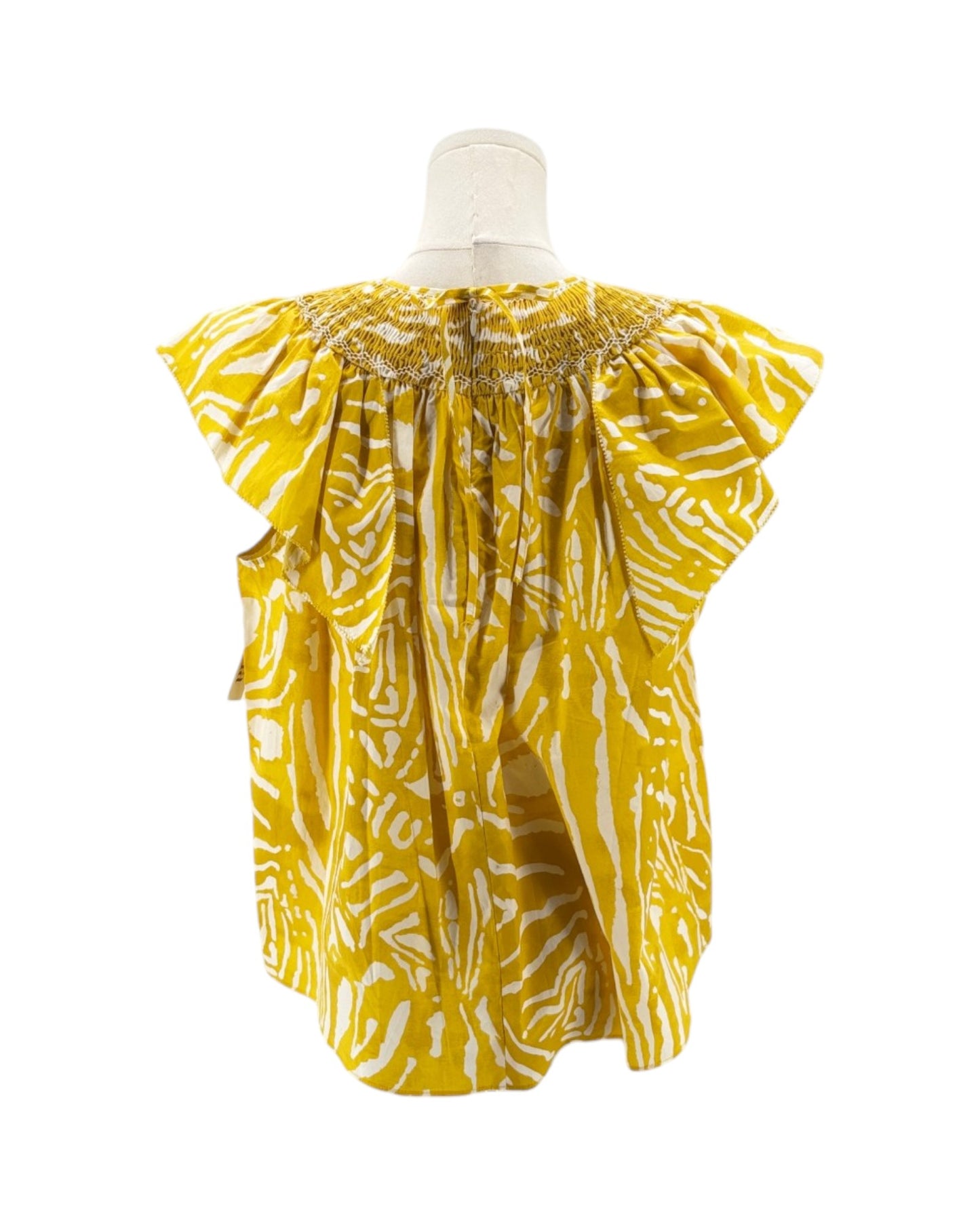 Yellow and white patterned baby romper on a mannequin against a white background
