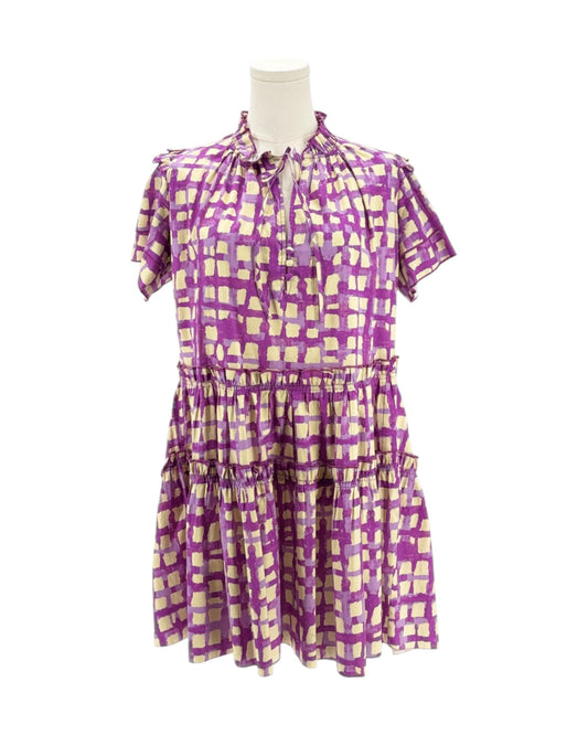 Purple and cream checkered dress on a mannequin against a white background