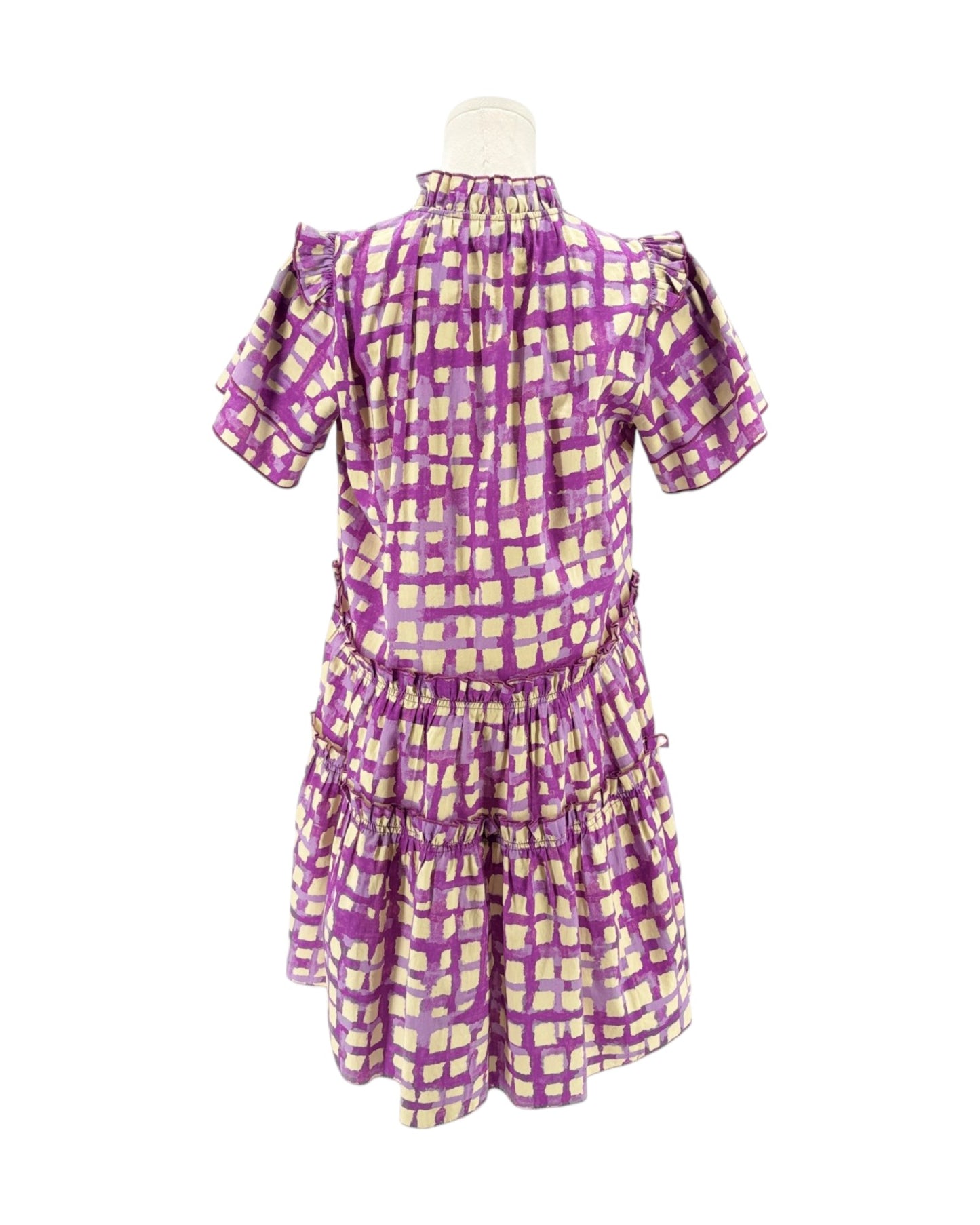 Purple and cream checkered dress on a mannequin against a white background