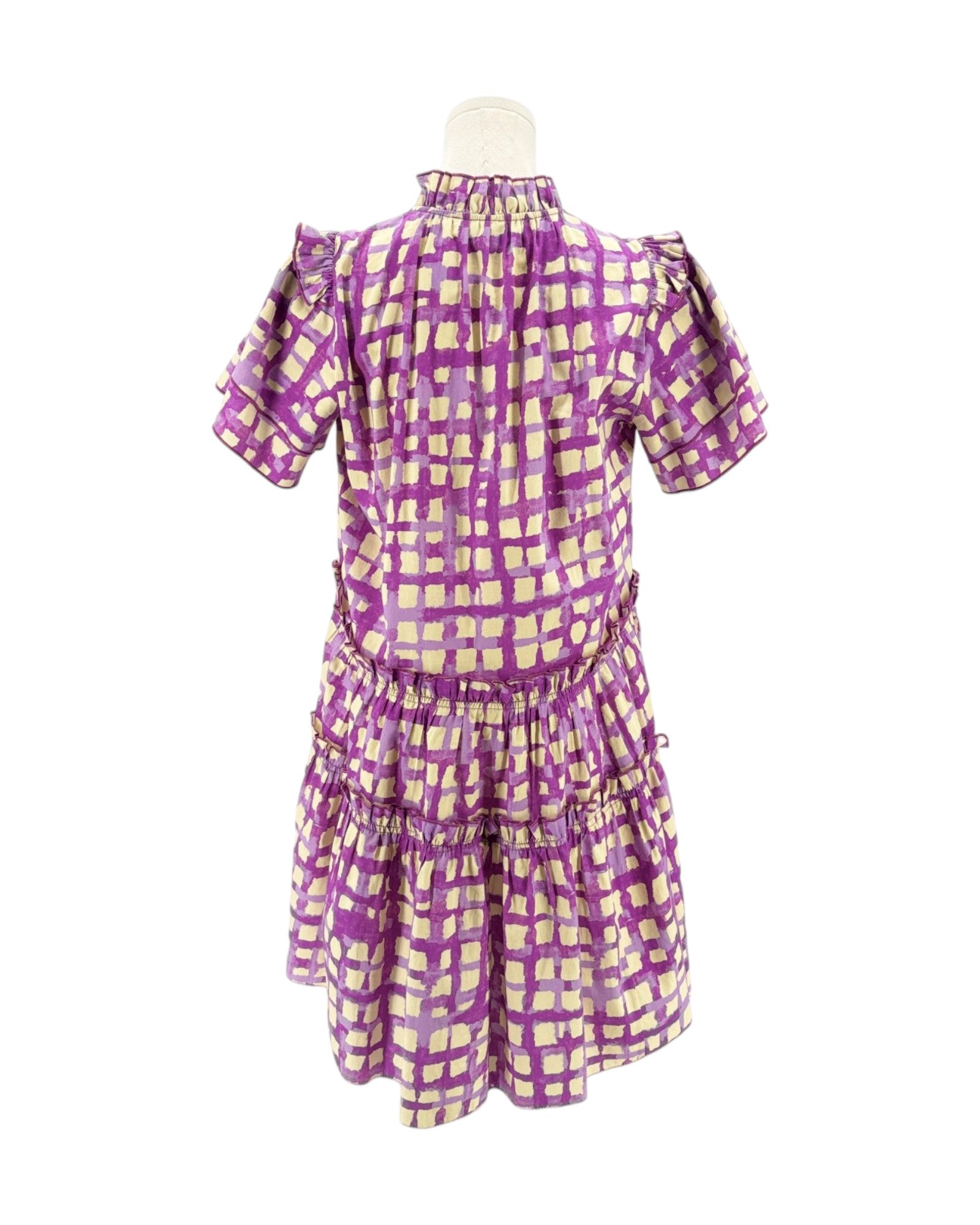Purple and cream checkered dress on a mannequin against a white background
