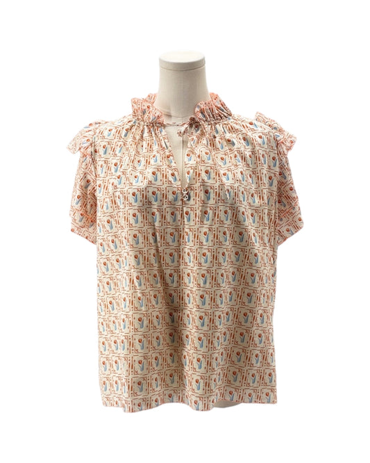 Short-sleeve blouse with floral pattern on a mannequin against a white background