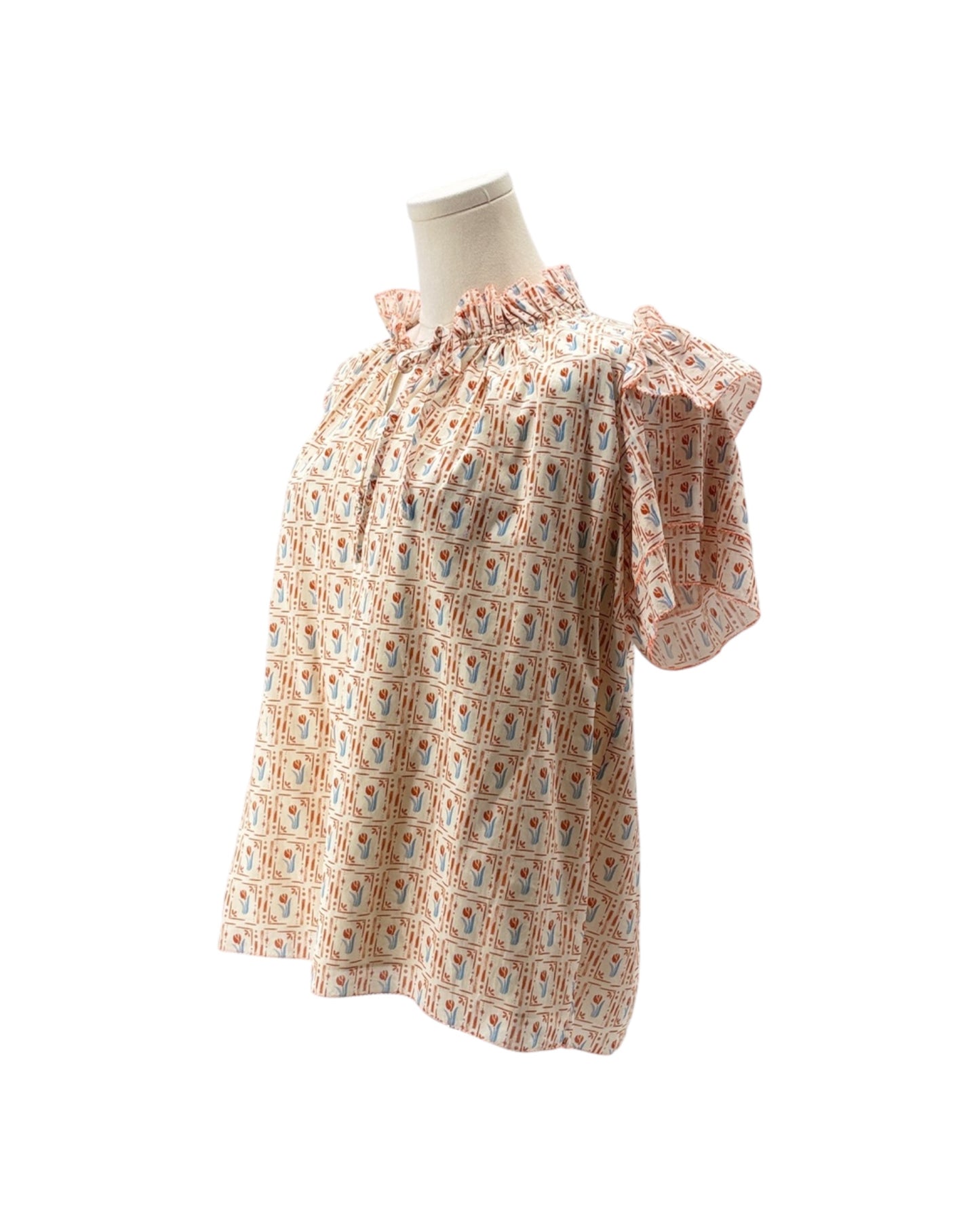Floral patterned dress on a mannequin against a white background
