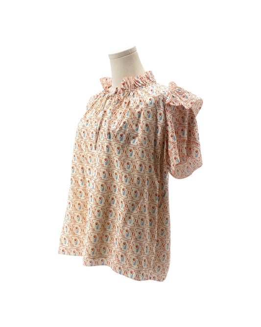 Floral patterned dress on a mannequin against a white background