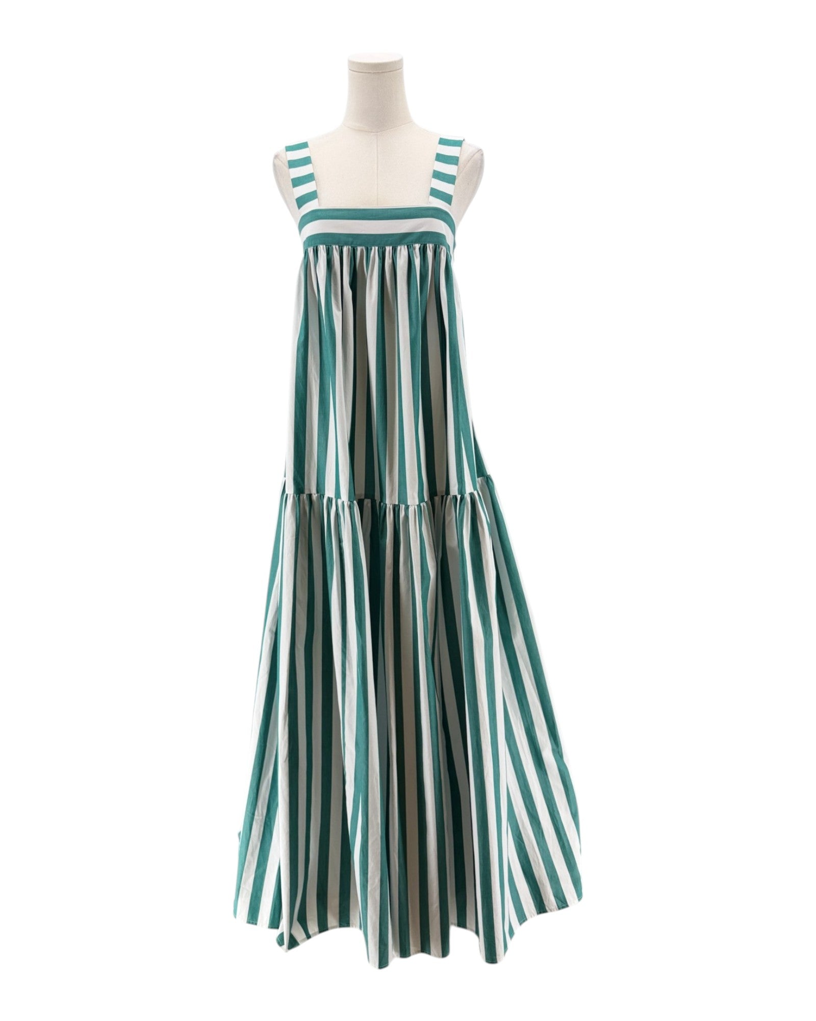 Striped dress on a mannequin against a white background