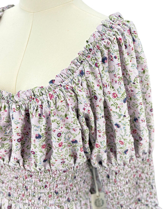 Hyacinth House floral dress on a mannequin against a white background