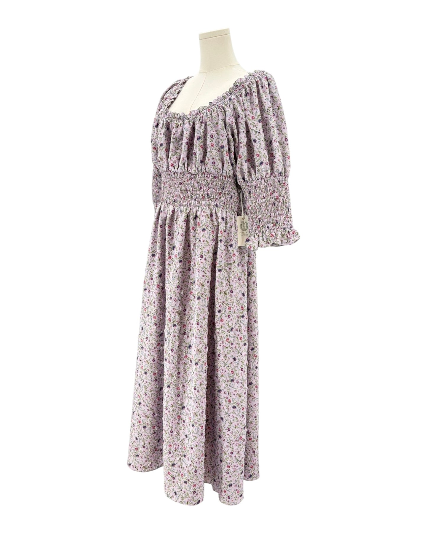 Hyacinth House floral dress on a mannequin against a white background