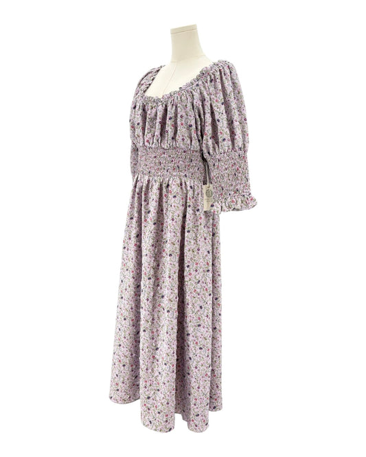 Hyacinth House floral dress on a mannequin against a white background