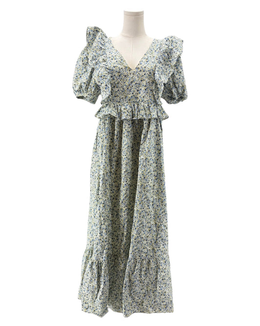 Floral dress on a mannequin against a white background