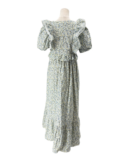 Floral dress on a mannequin against a white background
