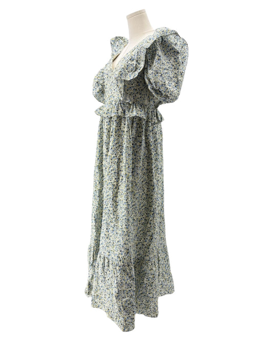 Floral dress on mannequin on a white background
